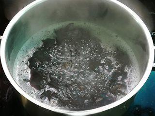 Spicy Black Fungus Salad with Peanuts step 2: Tear the black fungus into bite-sized pieces. Bring a pot of water to a boil, ad