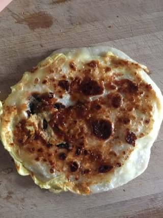 Stuffed Pancake with Egg and Sausage step 10: Spread a layer of garlic chili sauce over one side of the pancake.