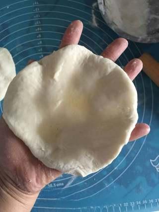 Stuffed Pancake with Egg and Sausage step 4: Brush a small amount of oil over the center of each dough round.