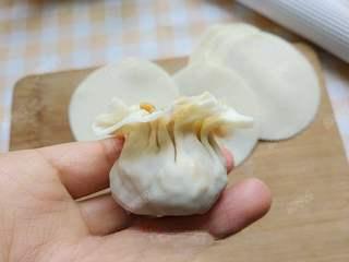 Steamed Rice and Pork Dumplings step 11: Gather the wrapper upward and gently pinch the opening closed.