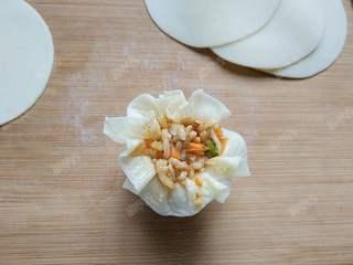 Steamed Rice and Pork Dumplings step 12: Adjust and shape the pleats to create an even, attractive finish.