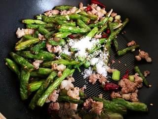 Stir-Fried String Beans with Minced Pork step 6: Return the fried string beans to the wok. Season with sugar, chicken seasoning,