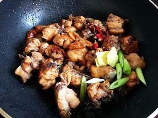 Chicken Thighs and Potato Stir-Fry step 6: Add scallions, ginger, dried chilies, and star anise. Stir-fry until fragrant.