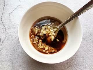 Bean Sprout Salad step 7: Combine sesame paste, soy sauce, vinegar, sugar, salt, minced garlic, and a litt