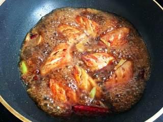 Braised Chicken Wings with Sweet and Savory Flavor step 7: Add enough water to nearly cover the wings. Stir in the sugar and dark soy sauce