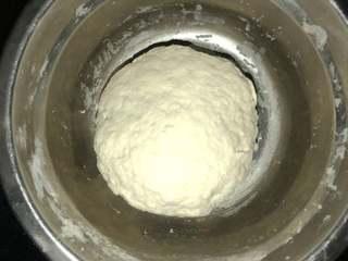 Sesame Twisted Steamed Rolls step 1: Combine the flour, water, and yeast and knead into a smooth dough. Cover and let