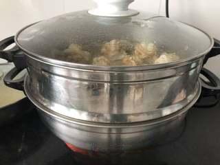 Sesame Twisted Steamed Rolls step 10: Steam over boiling water for about 15 minutes until fully cooked and fluffy.