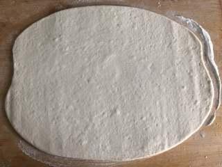 Sesame Twisted Steamed Rolls step 3: Roll the dough into a large rectangular sheet.