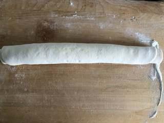 Sesame Twisted Steamed Rolls step 5: Roll the dough tightly into a log from one long side to the other.
