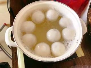 Sweet Red Bean Glutinous Rice Dumplings step 12: Cook until the dumplings float to the surface, indicating they are fully cooked.