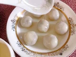 Sweet Red Bean Glutinous Rice Dumplings step 13: Transfer the dumplings to a serving bowl and spoon the prepared syrup over them.