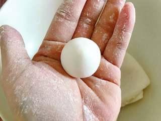 Sweet Red Bean Glutinous Rice Dumplings step 5: Pinch off a small portion of dough and roll it into a smooth ball.