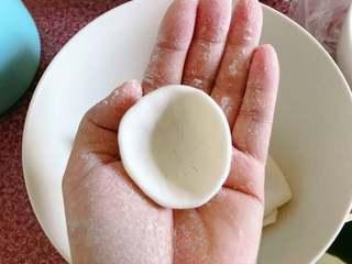 Sweet Red Bean Glutinous Rice Dumplings step 7: Press each dough ball into a small cup shape.