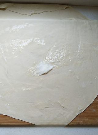 Scallion Pancakes step 4: Divide the dough into two portions and roll each into a large thin sheet. Spread