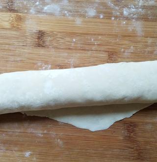 Scallion Pancakes step 7: Roll the dough tightly into a long log.