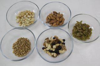 Five-Nut Mooncakes step 4: Coarsely crush the nuts and dried fruits using a rolling pin.