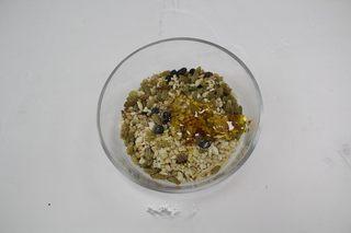 Five-Nut Mooncakes step 6: Combine the crushed nuts and dried fruits with honey and maltose syrup until eve