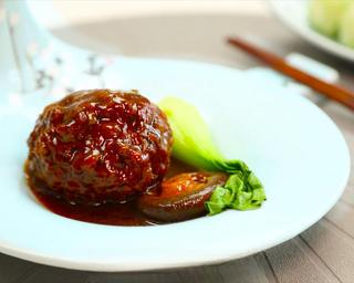 Braised Lion's Head Meatballs step 11: Arrange the meatballs on a serving plate with bok choy and mushrooms. Spoon the