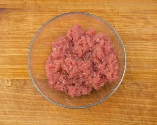 Braised Lion's Head Meatballs step 5: Gradually stir the water into the pork mixture in several additions. Mix in one