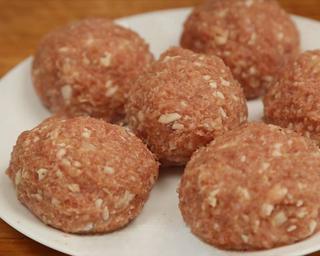 Braised Lion's Head Meatballs step 6: Add the diced water chestnuts, ginger, and green onion. Shape the mixture into l