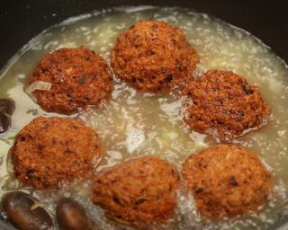 Braised Lion's Head Meatballs step 9: Add stock, fried meatballs, oyster sauce, soy sauce, dark soy sauce, and a littl