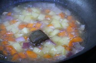 Vegetable Curry Rice step 9: Once the potatoes are tender, add the curry roux. Stir until fully melted and th