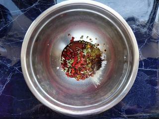 Spicy Steamed Chicken step 4: While the chicken steams, prepare the sauce by combining minced garlic, chopped