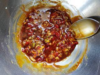 Spicy Steamed Chicken step 5: Add Sichuan pepper oil, sesame oil, and chili oil. Mix well and set aside.