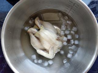 Spicy Steamed Chicken step 8: Submerge the cooked chicken in ice water to chill. This helps create a firmer te