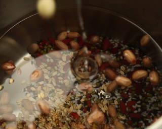 Eight Treasure Porridge step 4: Transfer all prepared ingredients to a pressure cooker and add enough water to c
