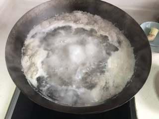 Winter Melon and Pork Rib Soup step 2: Place the ribs in a pot with cold water and a few ginger slices. Bring to a boil