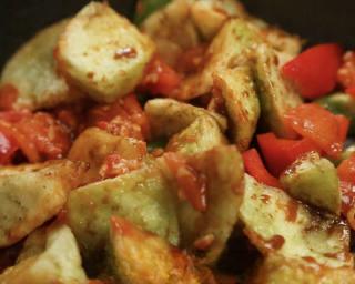 Braised Eggplant with Tomatoes and Peppers step 10: Add the fried eggplant and bell peppers. Pour in the prepared sauce and stir-fry