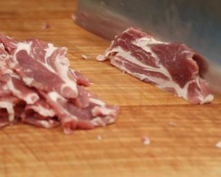 Scallion Lamb Stir-Fry step 4: Slice the lamb thinly across the grain.