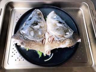 Steamed Fish Head with Chili Sauce step 6: Remove the fish head and carefully discard the steaming liquid to eliminate any 