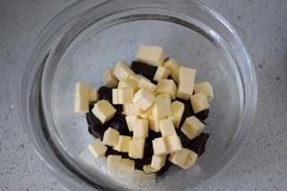 Dark Chocolate Walnut Brownies step 1: Melt the dark chocolate and butter separately over a double boiler until smooth.