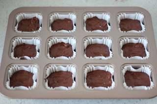 Dark Chocolate Walnut Brownies step 14: Pipe the batter into molds, filling each about 80% full.