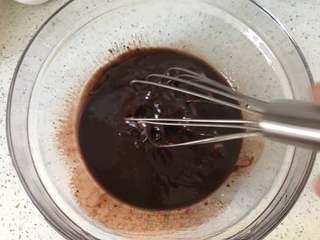 Dark Chocolate Walnut Brownies step 6: Combine the melted chocolate and butter, whisking until smooth. Preheat the oven