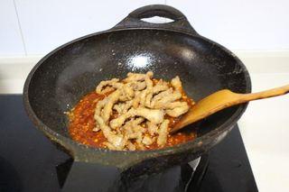Sweet and Sour Pork Strips step 12: Add the crispy pork strips to the pan.