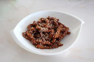 Sweet and Sour Pork Strips step 14: Transfer to a serving plate and sprinkle with toasted sesame seeds before servin