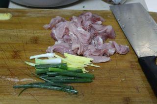Sweet and Sour Pork Strips step 2: Cut the pork loin into thick strips about the width of a chopstick. Slice the gi