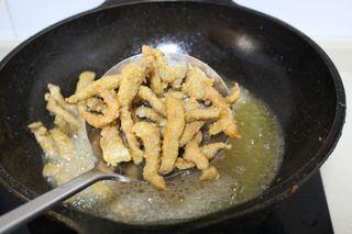 Sweet and Sour Pork Strips step 9: Increase the oil temperature and fry the pork strips a second time until deeply 