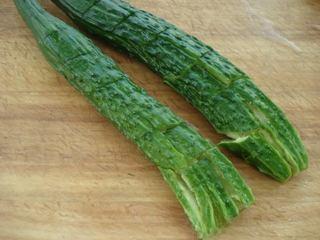 Smashed Cucumber Salad step 1: Wash the cucumbers and lightly smash them with the side of a knife until they cr