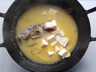 Crucian Carp and Tofu Soup step 7: Add the tofu and salt. Bring back to a boil and simmer for about 10 minutes to a