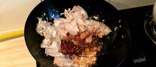 Twice-Cooked Pork with Peppers step 4: Add the chili bean paste and dark soy sauce. Stir-fry until the pork is evenly c