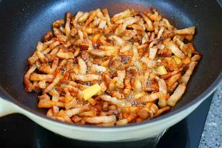 Braised Pork Belly with Mushrooms and Eggs step 11: Cook until the pork develops a light golden color. Remove excess rendered fat if