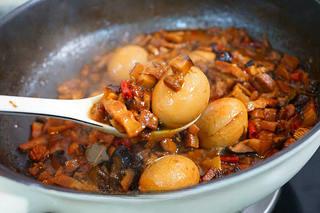 Braised Pork Belly with Mushrooms and Eggs step 20: Continue reducing the sauce to your preferred consistency.