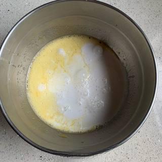 Coconut Egg Tart Recipe step 4: Strain the custard mixture through a fine-mesh sieve.