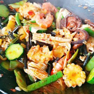 Spicy Mala Stir-Fry with Pork, Shrimp and Mixed Vegetables step 14: Season with chicken bouillon powder and cooking wine. Stir-fry until everything