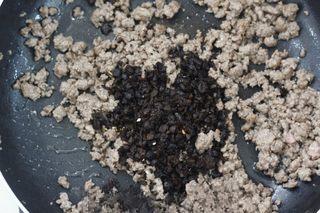 Spicy Beef Chili Crisp step 3: Heat oil in a wok over high heat. Add the minced beef and stir-fry until browned