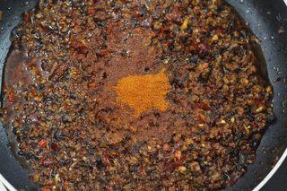 Spicy Beef Chili Crisp step 7: Add the chopped bird's eye chilies and stir-fry briefly.